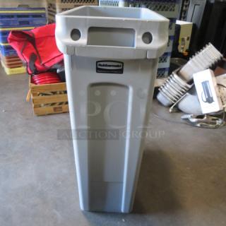 Rubbermaid Slim Jim trash can, appears new, gray, with logo visible on front.