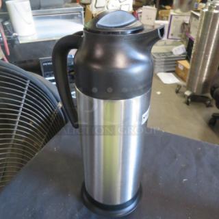 Supera CRSV-33 stainless steel creamer, new condition, sleek design, black handle and lid, ideal for restaurants.