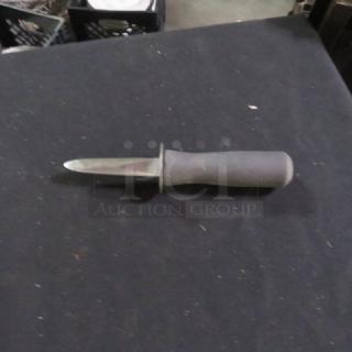 Oyster knife with a stainless steel blade and ergonomic black handle. Slightly used condition. Ideal for shucking oysters.