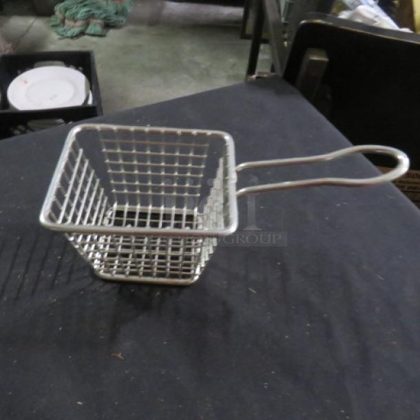 Stainless steel appetizer basket, new condition, 3.5x4x3 inches, with a grid design and handle. Ideal for serving.