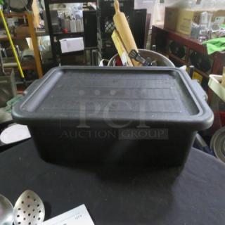 Black bussing tub with lid, rectangular, used condition, suitable for storage or transport.
