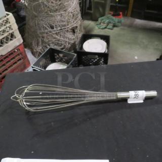 Stainless steel whip, wire balloon style, with a cylindrical handle. Tag labeled "682" attached.