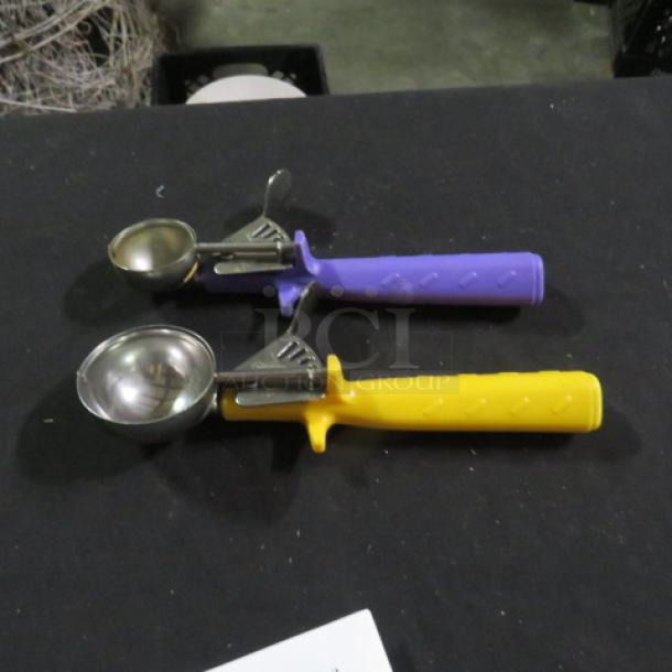 Assorted Size Dishers with purple and yellow handles; stainless steel scoops; minor wear; model 2XBID.