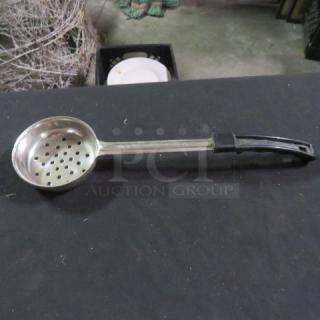 6oz perforated spoodle with stainless steel bowl and handle. Black grip, good condition. Ideal for draining and serving.