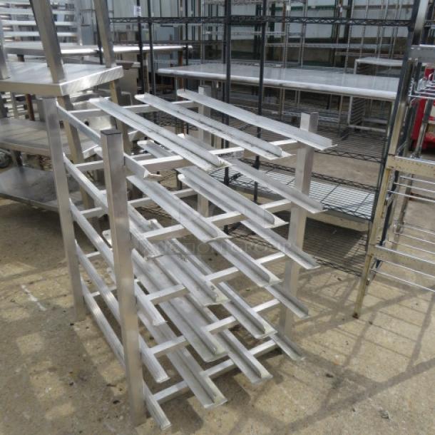 Winholt aluminum can rack, 25x34x36 inches. Features multiple angled shelves, sturdy frame; suitable for storage use.