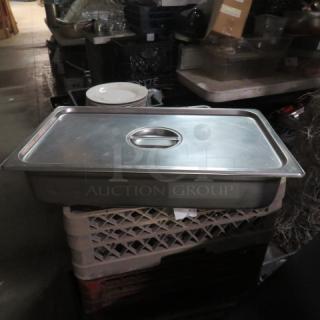 Full-size hotel pan, 4-inch deep, with lid. Stainless steel, good condition. Ideal for catering or food service use.