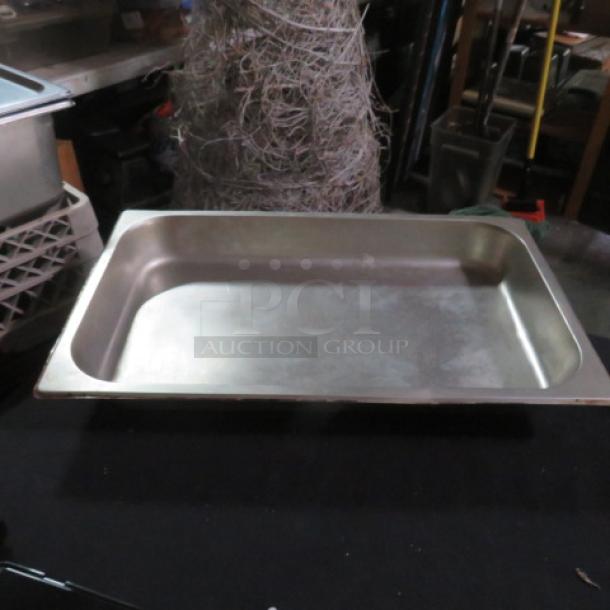 Full size 2.5 inch deep hotel pan, stainless steel, used, visible surface wear, auction item 2XBID.