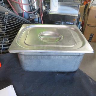 Half-size 6" deep hotel pan with lid, stainless steel, used condition, suitable for commercial kitchen use.