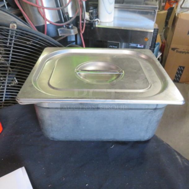 One Half Size 6 Inch Deep Hotel Pan with Lid, stainless steel, used condition, suitable for food service and catering.