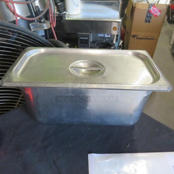One 1/3 size, 6-inch deep stainless steel hotel pan with lid, in good condition.