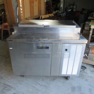 Delfield 1 Door Refrigerated Prep Table model 18648PTB, on casters, 48x31.5x43 inches, stainless steel, 115V, excellent condition.