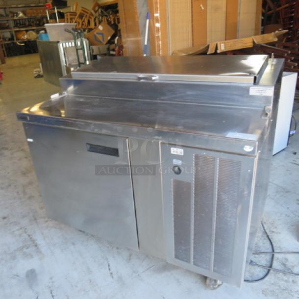 Delfield 18648PTB refrigerated prep table, one door, 48"x31.5"x43", with rack, on casters, 115V, stainless steel finish.