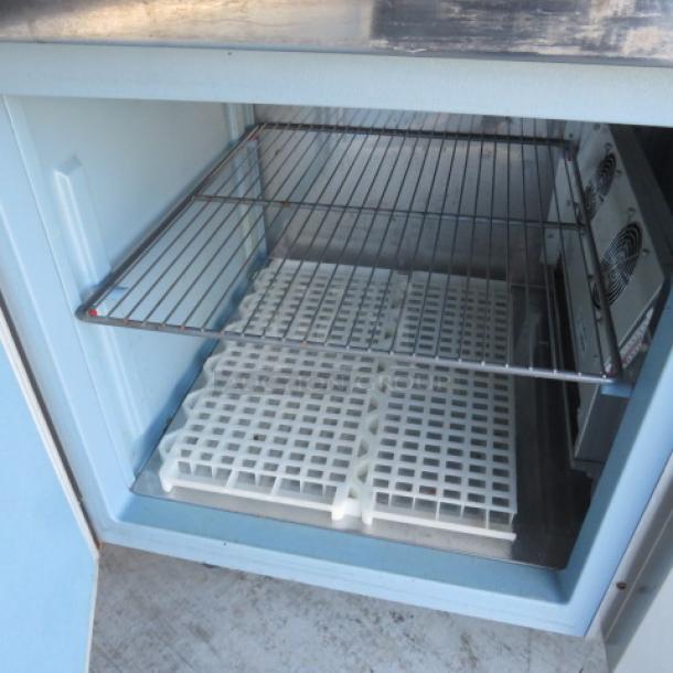 Delfield 1 Door Refrigerated Prep Table, Model 18648PTB, featuring one rack, casters, 48x31.5x43 inches, 115 Volt.