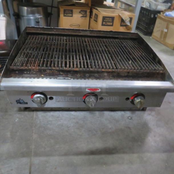 Star Max Natural Gas Charbroiler, 36x26x15 inches, stainless steel with three control knobs, used condition.