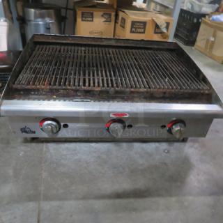 Star Max Natural Gas Charbroiler, 36x26x15 inches, stainless steel with three control knobs, used condition.