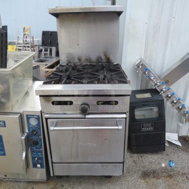 Sunfire 4-burner natural gas stove, model X24-4L, with stainless steel over shelf on casters, used condition.
