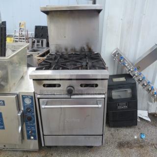 Sunfire 4-burner natural gas stove, model X24-4L, with stainless steel over shelf on casters, used condition.