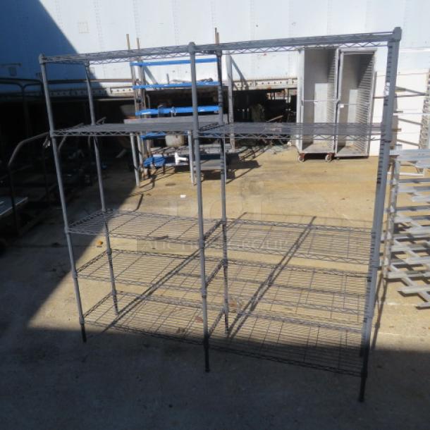 Black Metro shelf unit, 58x14x59 inches, metal construction, three tiers, durable condition, suitable for storage.