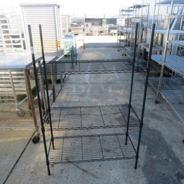Black Metro shelf, 35.5x16x54 inches, metal, sturdy, four-tier design, excellent condition, suitable for storage.