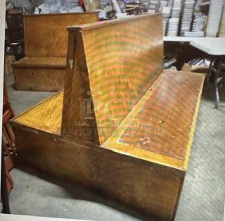 Wooden double-sided booth, dimensions 50x50x43.5 inches, showing signs of wear, ideal for seating areas.