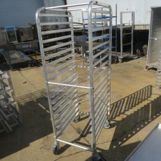 Regency aluminum speed rack, 20.5x26x63.5 inches, on casters. Features multiple shelves, durable condition. Ideal for storage.