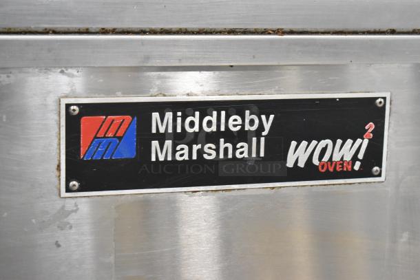 Middleby Marshall PS638G label on stainless steel commercial natural gas conveyor pizza oven. "WOW! Oven" branding visible.