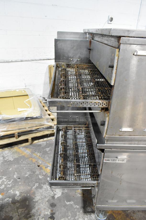 Two Middleby Marshall PS638G stainless steel conveyor pizza ovens on casters, showing used condition.