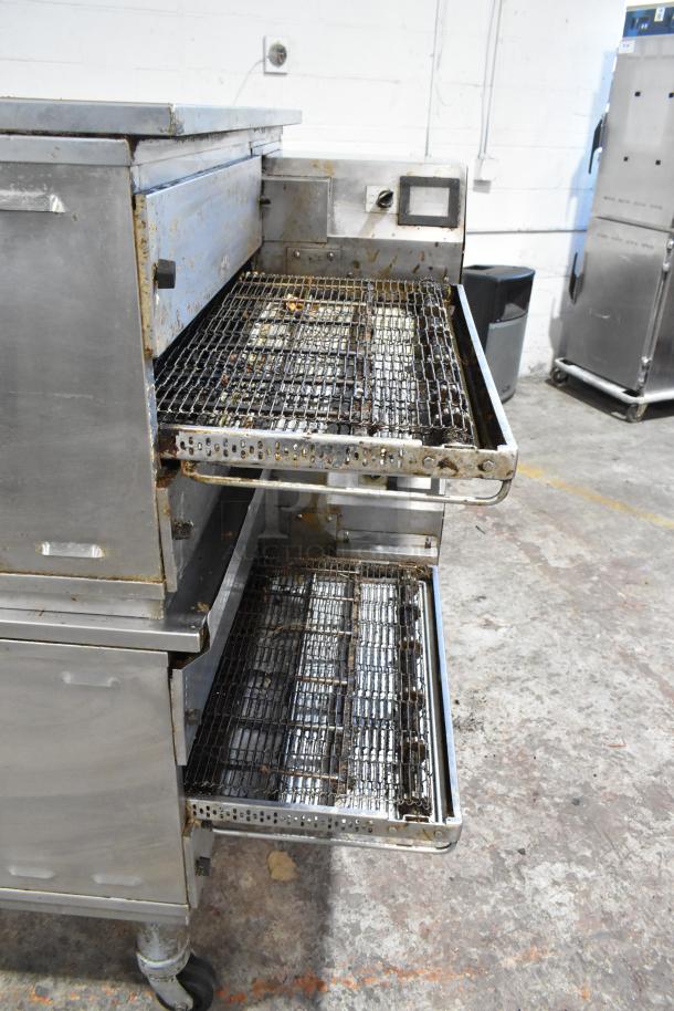 2 Middleby Marshall PS638G stainless steel conveyor pizza ovens on casters, natural gas, 89,000 BTU, used condition.