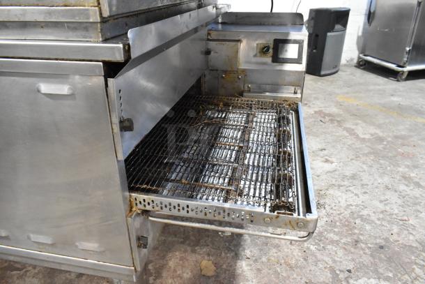 Middleby Marshall PS638G stainless steel conveyor pizza oven, natural gas, 89,000 BTU, on commercial casters, used condition.