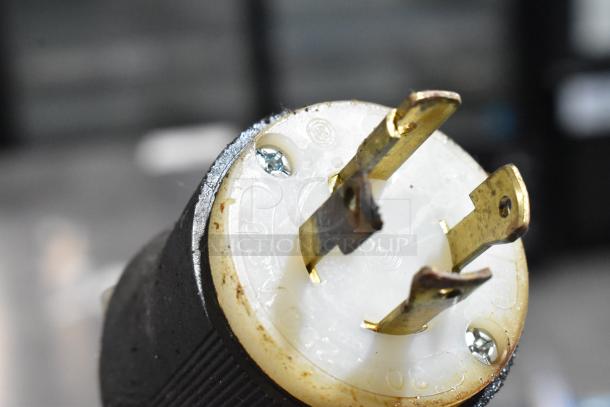 Close-up of an electric plug from a 2019 Middleby Marshall CTX DZ33I stainless steel commercial conveyor pizza oven.