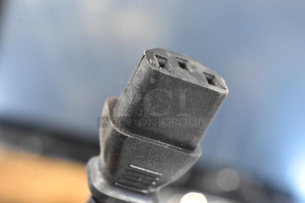 Close-up of a power connector for the 2024 Hobart HTi-SSLSC Scale, emphasizing the plug design and condition.