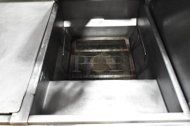 Vulcan 2TR45CF-1 natural gas fryer with filtration, stainless steel, 2 bays, on commercial casters, 140,000 BTU, used condition.