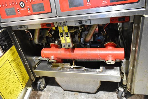 Vulcan 2TR45CF-1 stainless steel gas fryer, 2 bays, filtration system, commercial casters, 140,000 BTU, visible controls.