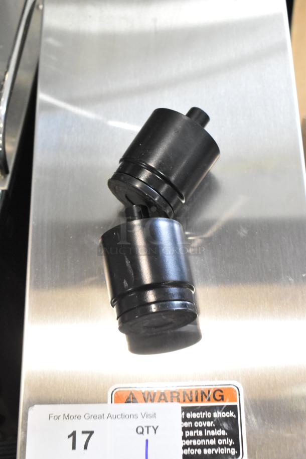 Schaerer Coffee Art Plus espresso machine with black hoppers on a metal base, warning label visible.