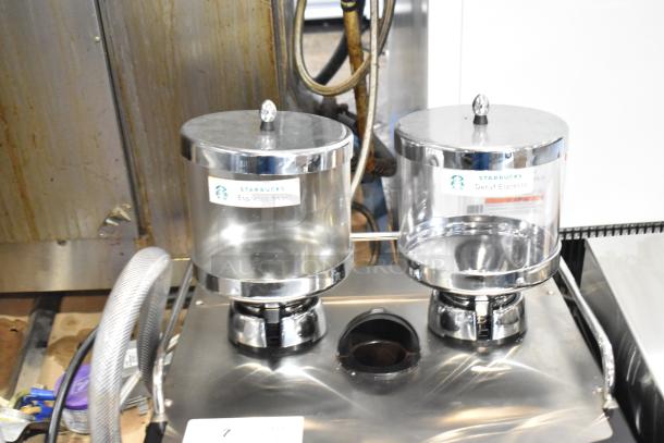 Schaerer Coffee Art Plus commercial espresso machine with metal finish, dual hoppers, and Starbucks labels, 120-208/240V, 1 Phase.
