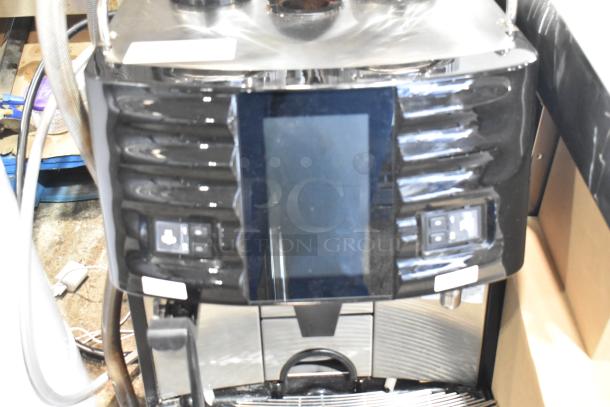 Schaerer Coffee Art Plus commercial espresso machine, black metal, countertop model with hoppers, touchscreen interface.