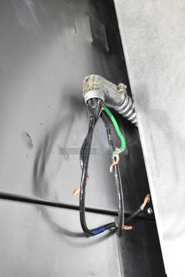 Nu Vu OP-4/8M electric oven proofer, stainless steel on casters. 208V, 3-phase. Visible wiring, needs repair.
