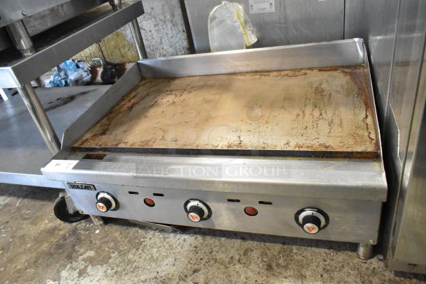 Vulcan VCRG36-T1 stainless steel commercial griddle, natural gas, flat top, three dials, used condition.