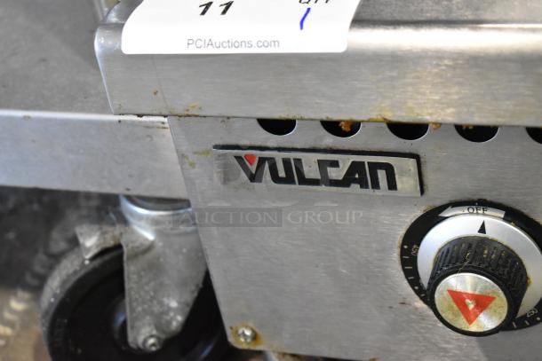 Vulcan VCRG36-T1 stainless steel commercial countertop griddle, natural gas, visible brand logo, control knob, and caster wheel.