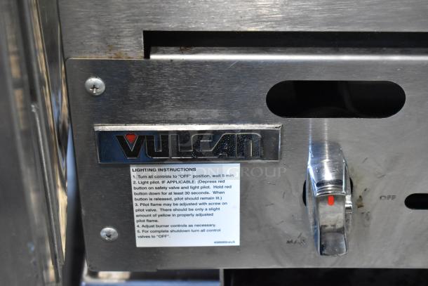 Vulcan VACB36-101 stainless steel commercial charbroiler with control knob, brand logo, lighting instructions visible.
