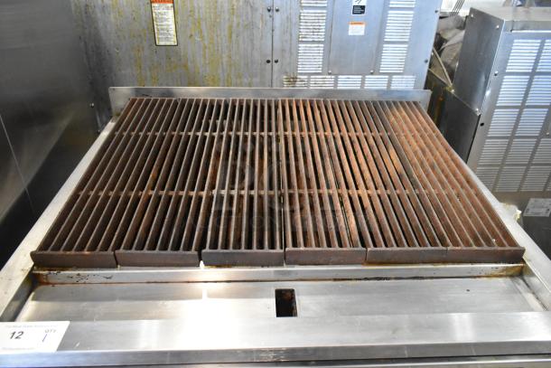 Vulcan VACB36-101 stainless steel countertop charbroiler grill, natural gas-powered, on equipment stand with casters.