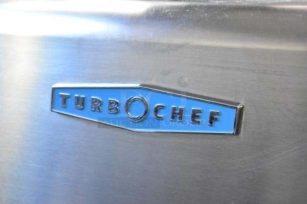Turbochef HCS1618 stainless steel logo on a commercial countertop electric rapid cook oven.
