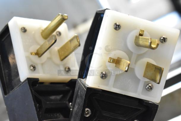 Close-up of the plug connectors for a 2018 Turbochef HCS1618 countertop rapid cook oven, 208/240V, 1 phase.