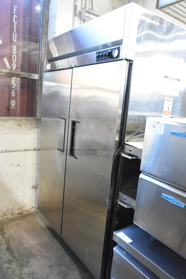 True TA2H-2S stainless steel commercial 2-door reach-in warming cabinet with racks, 115/208-240V, 1 phase, excellent condition.