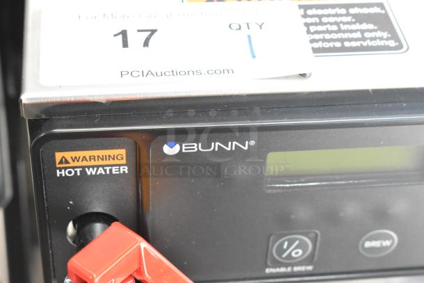 BRAND NEW 2022 Bunn AXIOM-DV-APS stainless steel coffee brewer, hot water dispenser, 120V, warning labels visible.