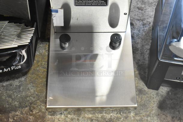 Stainless steel Bunn AXIOM-DV-APS coffee brewer with hot water dispenser. Brand new with minor scratches. 120V, 1 phase.