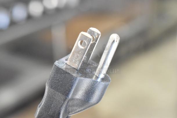 Close-up of a power plug for a 2022 Bunn AXIOM-DV-APS coffee brewer, 120 volts, 1 phase.