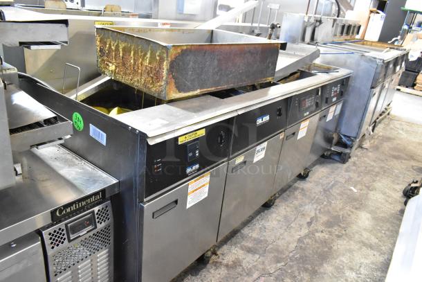 Giles EOF-24 commercial electric fryer, 3 bays, center dumping station, stainless steel, on casters, 480V, 3-phase, used condition.