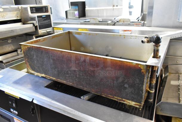 Giles EOF-24 stainless steel 3 bay deep fat fryer with center dumping station, commercial casters, 480V, 3 phase. Signs of use.