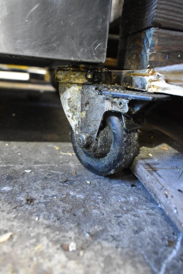 Giles EOF-24 fryer commercial caster, showing wear; part of stainless steel electric fryer, 480V, 3 Phase.